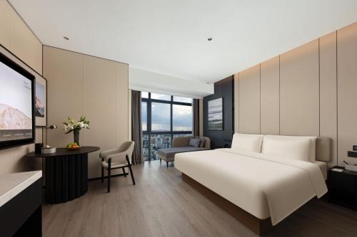 Imagen de la habitación del Hotel Atour Haikou Wanguo Metropolis Qilou Old Street. Foto 18