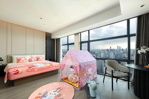 Imagen de la habitación del Hotel Atour Haikou Wanguo Metropolis Qilou Old Street. Foto 19