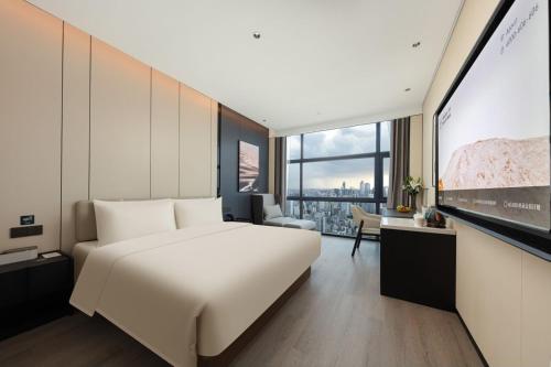 Imagen de la habitación del Hotel Atour Haikou Wanguo Metropolis Qilou Old Street. Foto 20