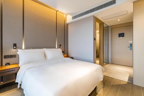 Imagen de la habitación del Hotel Atour Hangzhou Qiandao Lake Central Dock. Foto 18