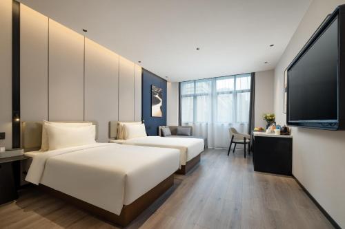 Imagen de la habitación del Hotel Atour Hangzhou Xintiandi Zhongda Intime. Foto 18