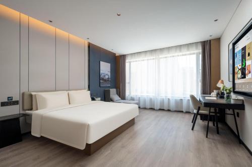 Imagen de la habitación del Hotel Atour Hotel Qingdao Tangdao Bay Jinggangshan Station. Foto 2