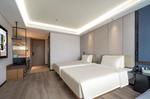 Imagen de la habitación del Hotel Atour Hotel Qingdao Tangdao Bay Jinggangshan Station. Foto 3