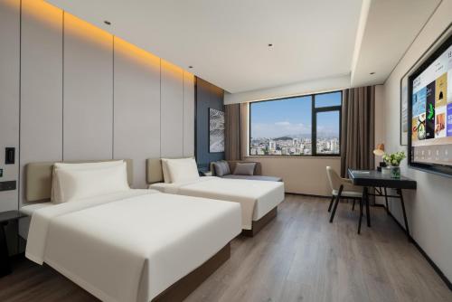 Imagen de la habitación del Hotel Atour Hotel Qingdao Tangdao Bay Jinggangshan Station. Foto 5