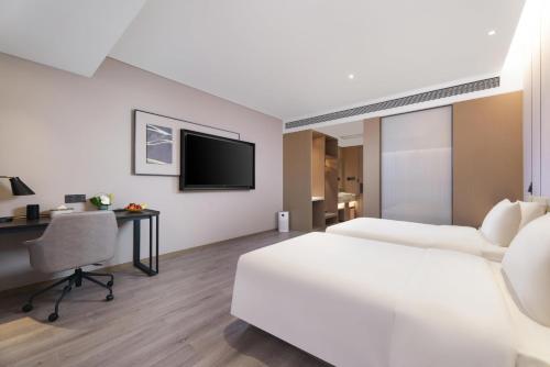 Imagen de la habitación del Hotel Atour Jinan West Railway Station. Foto 14