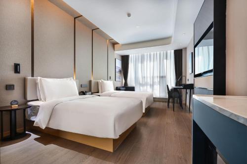 Imagen de la habitación del Hotel Atour Kunming Changshui International Airport. Foto 12