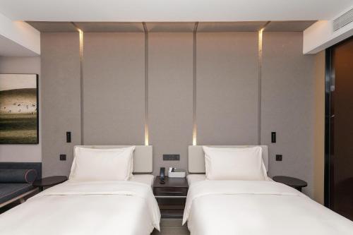 Imagen de la habitación del Hotel Atour Kunming Changshui International Airport. Foto 15