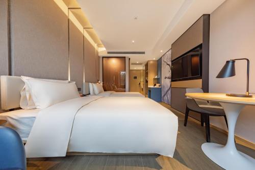 Imagen de la habitación del Hotel Atour Kunming Cuihu. Foto 14