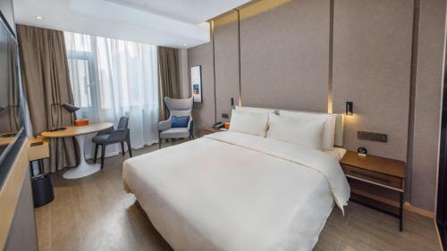 Imagen de la habitación del Hotel Atour Kunming Cuihu. Foto 18