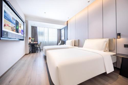 Imagen de la habitación del Hotel Atour Kunming Railway Station Joy City. Foto 19
