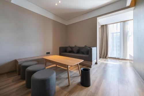 Imagen de la habitación del Hotel Atour Kunming South High Speed ​​Railway Station University Town. Foto 17