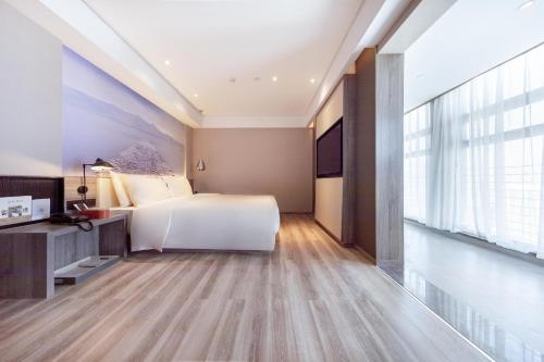 Imagen de la habitación del Hotel Atour Kunming South High Speed ​​Railway Station University Town. Foto 18