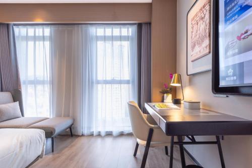 Imagen de la habitación del Hotel Atour Kunming Xiaokang Avenue. Foto 12