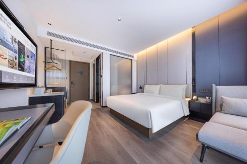 Imagen de la habitación del Hotel Atour Kunming Xiaokang Avenue. Foto 16