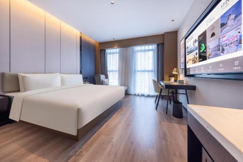 Imagen de la habitación del Hotel Atour Kunming Xiaokang Avenue. Foto 17