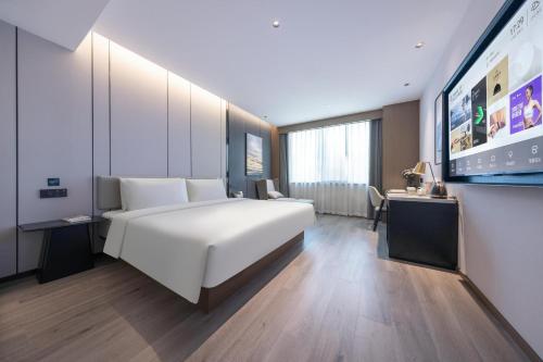 Imagen de la habitación del Hotel Atour Kunming Yunnan-Burma Avenue. Foto 12