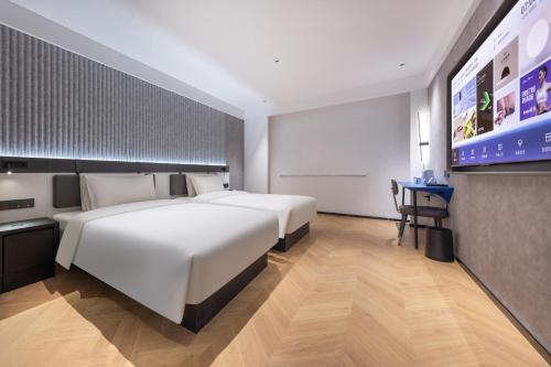 Imagen de la habitación del Hotel Atour Light Fuzhou Sanfang Qixiang. Foto 20
