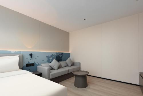 Imagen de la habitación del Hotel Atour Light Haikou Guomao Wanlv Garden. Foto 17