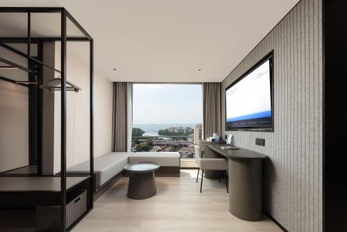 Imagen de la habitación del Hotel Atour Light Haikou Guomao Wanlv Garden. Foto 18