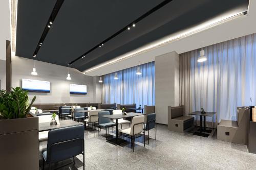 Imagen del bar/restaurante del Hotel Atour Light Haikou Guomao Wanlv Garden. Foto 11