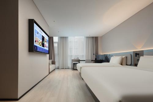 Imagen de la habitación del Hotel Atour Light Hotel Shanghai Daning International Shibei High-tech Park. Foto 16
