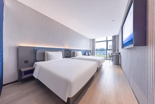Imagen de la habitación del Hotel Atour Light Hotel Shanghai Daning International Shibei High-tech Park. Foto 19