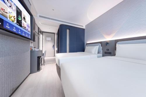 Imagen de la habitación del Hotel Atour Light Nanjing Xinjiekou Presidential Palace. Foto 5