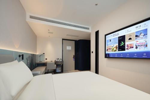 Imagen de la habitación del Hotel Atour Light Qingdao Zhanqiao Guancheng Road. Foto 2
