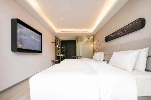 Imagen de la habitación del Hotel Atour Light Shanghai Xinzhuang Zhuanqiao Wanda. Foto 17