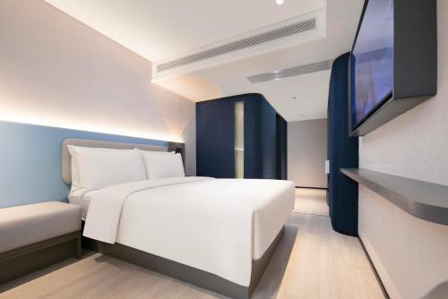 Imagen de la habitación del Hotel Atour Light Wuhan Jiangtan Jianghan Road Pedestrian Street. Foto 13