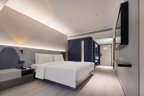 Imagen de la habitación del Hotel Atour Light Wuhan Jiangtan Jianghan Road Pedestrian Street. Foto 15