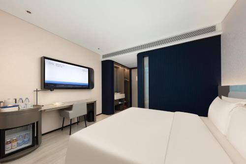 Imagen de la habitación del Hotel Atour Light Wuxi Taihu Lake Expo Center Financial Street. Foto 7
