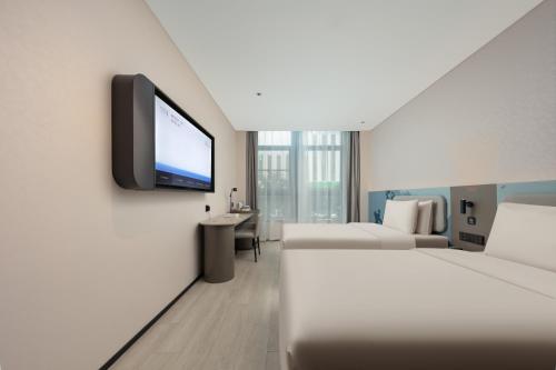 Imagen de la habitación del Hotel Atour Light Wuxi Taihu Lake Expo Center Financial Street. Foto 14