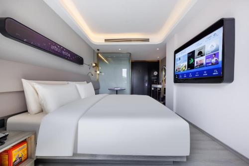 Imagen de la habitación del Hotel Atour Light Zhuguang Road Hongqiao National Exhibition and Convention Center. Foto 18