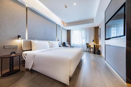 Imagen de la habitación del Hotel Atour Light Zhuhai Qinglv Road Theater. Foto 13