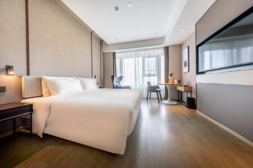 Imagen de la habitación del Hotel Atour Linyi Beijing Road. Foto 13
