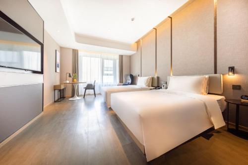 Imagen de la habitación del Hotel Atour Linyi Beijing Road. Foto 14