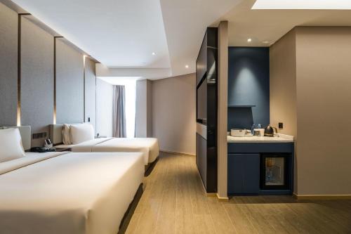 Imagen de la habitación del Hotel Atour Ningbo Bund Road Jinxintiandi. Foto 11