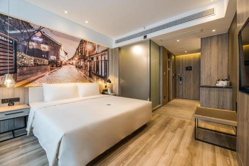 Imagen de la habitación del Hotel Atour Ningbo Laowaitan. Foto 8