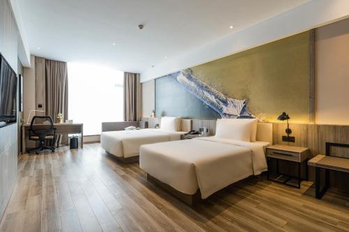Imagen de la habitación del Hotel Atour Ningbo Laowaitan. Foto 9