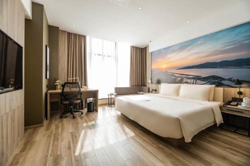 Imagen de la habitación del Hotel Atour Ningbo Laowaitan. Foto 10