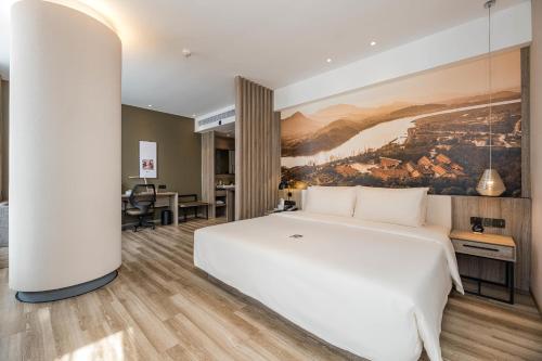 Imagen de la habitación del Hotel Atour Ningbo Laowaitan. Foto 11