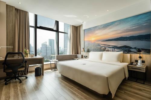 Imagen de la habitación del Hotel Atour Ningbo Laowaitan. Foto 13