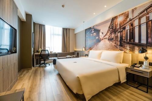 Imagen de la habitación del Hotel Atour Ningbo Laowaitan. Foto 14