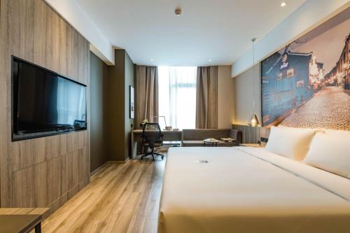 Imagen de la habitación del Hotel Atour Ningbo Laowaitan. Foto 16
