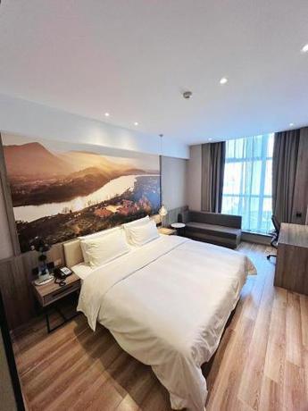Imagen de la habitación del Hotel Atour Ningbo Laowaitan. Foto 18