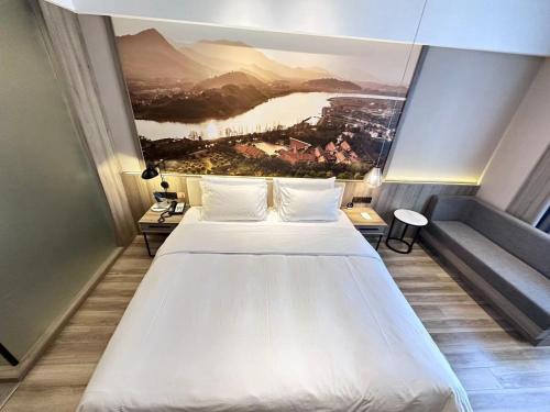 Imagen de la habitación del Hotel Atour Ningbo Laowaitan. Foto 19