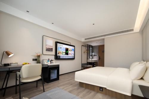 Imagen de la habitación del Hotel Atour Ningbo Ninghai. Foto 16