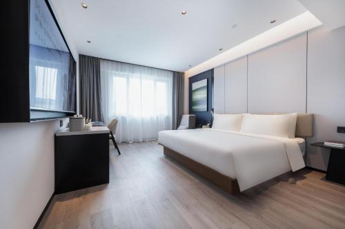 Imagen de la habitación del Hotel Atour Qingdao Laoshan Shilaoren Beach. Foto 11