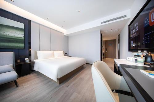 Imagen de la habitación del Hotel Atour Qingdao Laoshan Shilaoren Beach. Foto 14